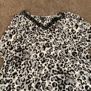 We gave black and white cheeta print blouse